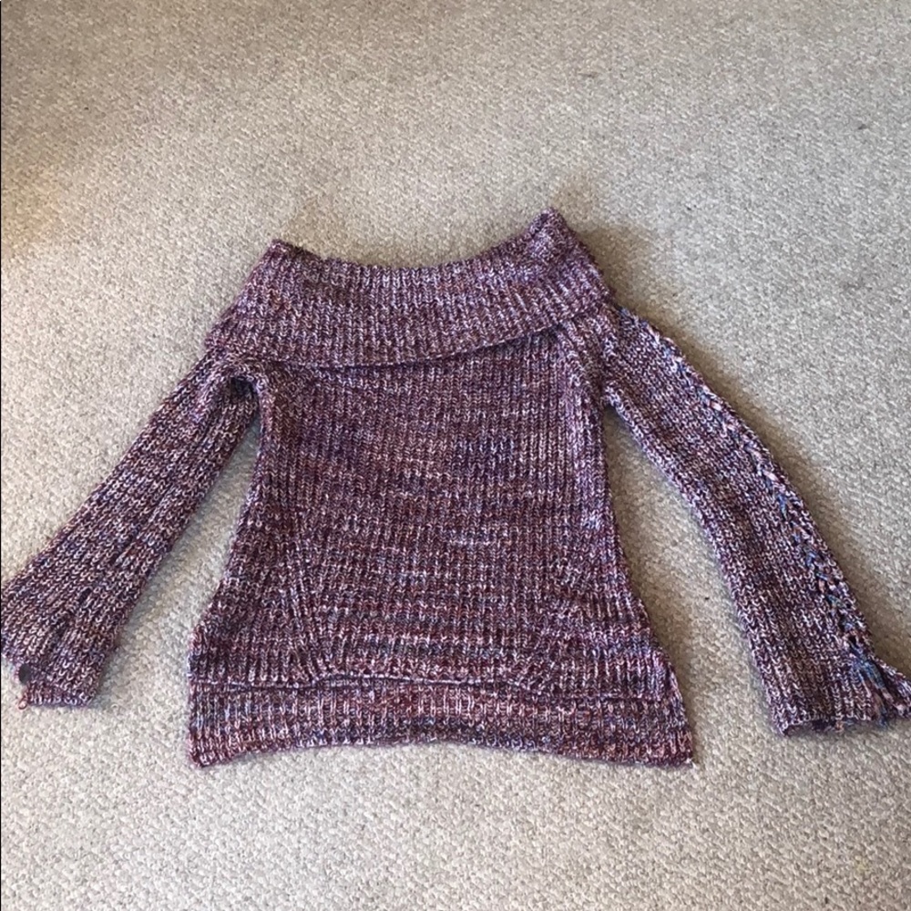 Cowlneck sweater with braided arm detail.